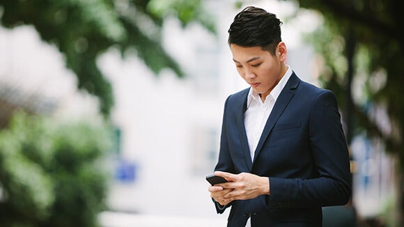 asian-male-on-cellphone