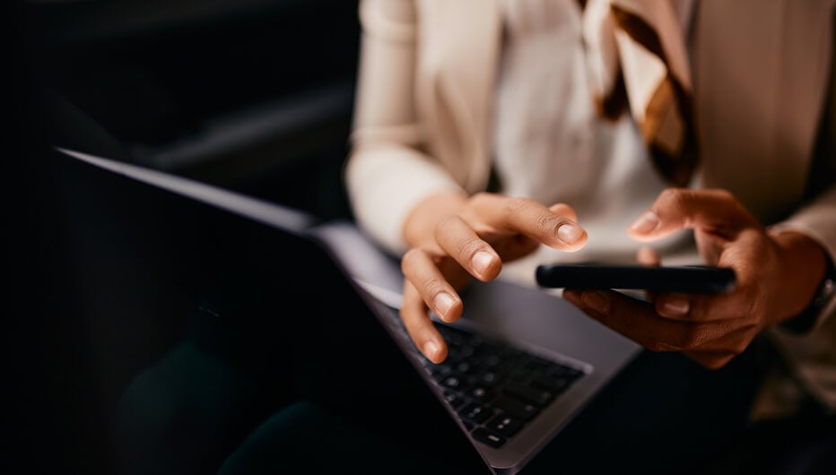 man typing down notes