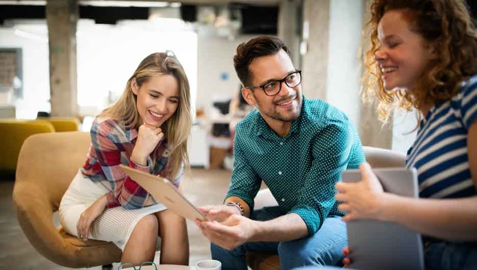 Business people having fun and chatting at workplace office